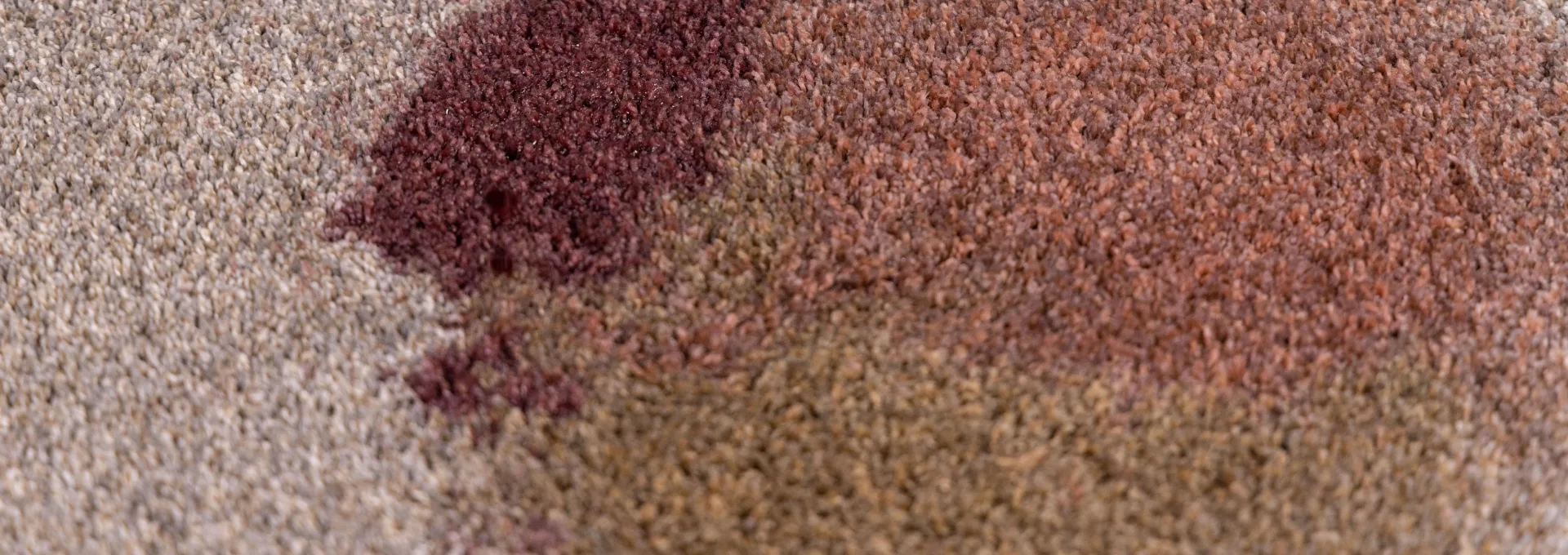PureColor High-Def carpet with red wine and food stains before cleaning to demonstrate stain resistance.