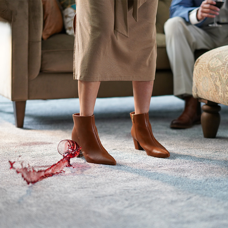 Palos Hills carpet in Evermore shown with a red wine spill in a furnished living room