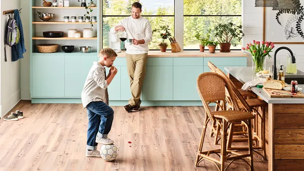 Tradewind 6215 Folly hard surface flooring in a family kitchen with a father and child